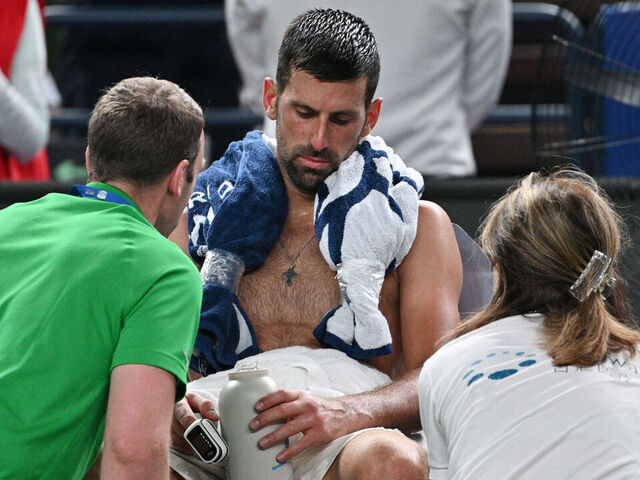 Serbia's Novak Djokovic receives medical attention during his men's singles match against Spain's Jaume Munar at the Shanghai Masters tennis tournament in Shanghai on October 7, 2025.