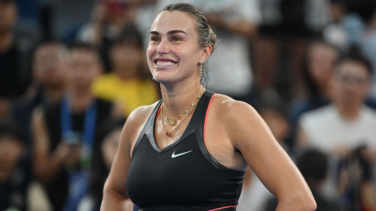 Belarus's Aryna Sabalenka smiles after winning against Slovakia's Rebecca Sramkova during their women's singles match at the Wuhan Open tennis tournament in Wuhan, Central China's Hubei province on October 8, 2025.