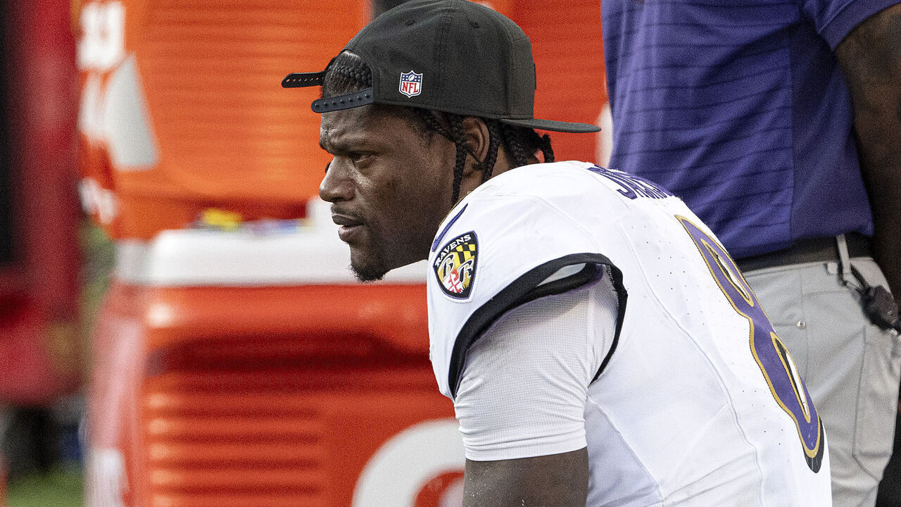 KANSAS CITY, MISSOURI - SEPTEMBER 28: Lamar Jackson #8 of the Baltimore Ravens sits on the sidelines during the fourth quarter of the game against the Kansas City Chiefs at Arrowhead Stadium on September 28, 2025 in Kansas City, Missouri.""