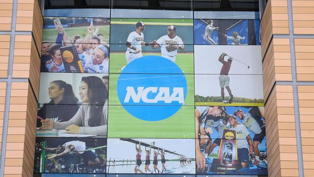 INDIANAPOLIS, IN - JUNE 19: A general view of the NCAA logo on the building exterior of the National Collegiate Athletic Association (NCAA) National Office on June 19, 2025, in Indianapolis, IN. The NCAA National Office serves as the corporate headquarters for the NCAA.