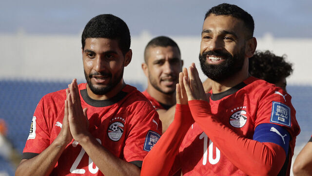 Egypt's forward #20 Ibrahim Adel celebrates with forward #10 Mohamed Salah after scoring his team's first goal during the FIFA World Cup 2026 Africa qualifier football match between Djibouti and Egypt at the Larbi Zaouli Stadium in Casablanca on October 8, 2025.