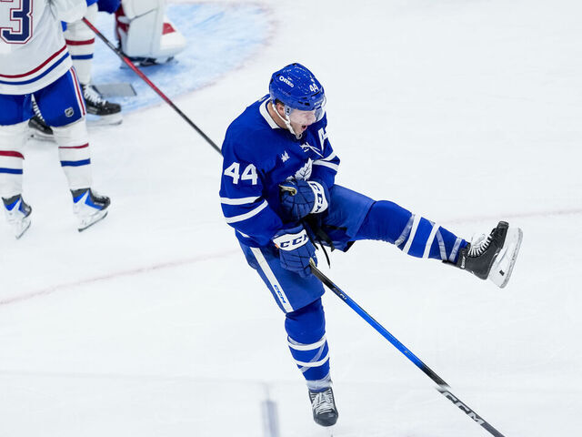 TORONTO, CANADA - OCTOBER 8: Morgan Rielly #44 of the Toronto Maple Leafs celebrates scoring a goal during the third period against the Montreal Canadiens at the Scotiabank Arena on October 8, 2025 in Toronto, ON, Canada.
