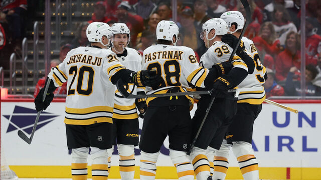 WASHINGTON, DC - OCTOBER 08: David Pastrnak #88 of the Boston Bruins celebrates with teammates after scoring a goal against the Washington Capitals during the second period at Capital One Arena on October 8, 2025 in Washington, DC.