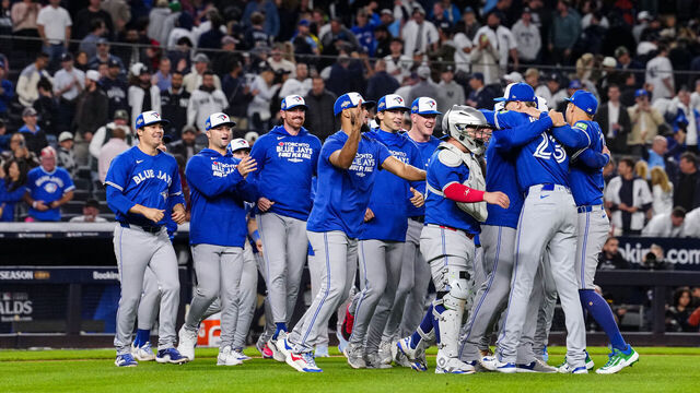 NEW YORK, NY - OCTOBER 08: The Toronto Blue Jays celebrate after winning Game Four of the American League Division Series presented by Booking.com between the Toronto Blue Jays and the New York Yankees at Yankee Stadium on Wednesday, October 8, 2025 in New York, New York. The Toronto Blue Jays won 5-2 and will advance to the American League Championship Series.