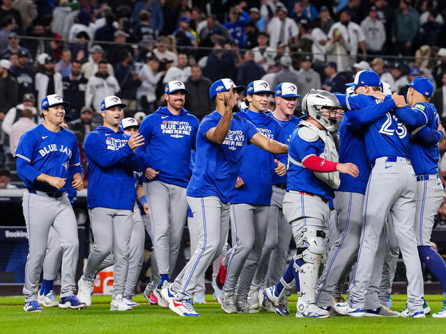 NEW YORK, NY - OCTOBER 08: The Toronto Blue Jays celebrate after winning Game Four of the American League Division Series presented by Booking.com between the Toronto Blue Jays and the New York Yankees at Yankee Stadium on Wednesday, October 8, 2025 in New York, New York. The Toronto Blue Jays won 5-2 and will advance to the American League Championship Series.