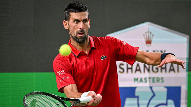 Serbia's Novak Djokovic hits a return to Belgium's Zizou Bergs during their quarter-final men's singles match at the Shanghai Masters tennis tournament in Shanghai on October 9, 2025.