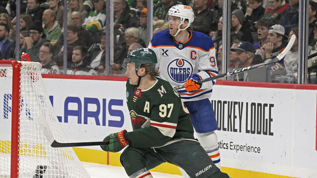 ST. PAUL, MN - DECEMBER 12: Minnesota Wild forward Kirill Kaprizov (97) and Edmonton Oilers forward Connor McDavid (97) follow the play during the first period of an NHL game between the Minnesota Wild and Edmonton Oilers on December 12, 2024, at Xcel Energy Center in St. Paul, MN.