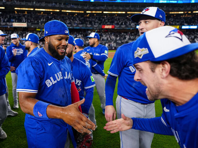 NEW YORK, NY - OCTOBER 08: Vladimir Guerrero Jr. #27 and Ernie Clement #22 of the Toronto Blue Jays celebrate after winning Game Four of the American League Division Series presented by Booking.com between the Toronto Blue Jays and the New York Yankees at Yankee Stadium on Wednesday, October 8, 2025 in New York, New York. The Toronto Blue Jays won 5-2 and will advance to the American League Championship Series.