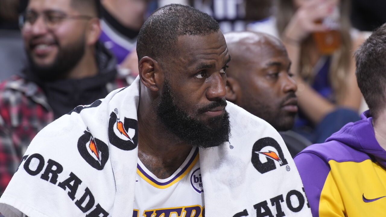 SACRAMENTO, CA - DECEMBER 21: LeBron James #23 of the Los Angeles Lakers looks on from the bench during the game against the Sacramento Kings on December 21, 2024 at Golden 1 Center in Sacramento, California. NOTE TO USER: User expressly acknowledges and agrees that, by downloading and or using this photograph, User is consenting to the terms and conditions of the Getty Images Agreement. Mandatory Copyright Notice: Copyright 2024 NBAE