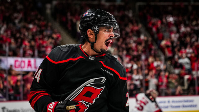 RALEIGH, NORTH CAROLINA - OCTOBER 09: Seth Jarvis #24 of the Carolina Hurricanes celebrates after a goal during the third period against the New Jersey Devils at Lenovo Center on October 09, 2025 in Raleigh, North Carolina.