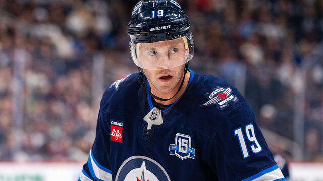 WINNIPEG, CANADA - OCTOBER 9: Jonathan Toews #19 of the Winnipeg Jets prepares for a face-off in the second period against the Dallas Stars at Canada Life Centre on October 9, 2025 in Winnipeg, Canada at Canada Life Centre on October 9, 2025 in Winnipeg, Canada.