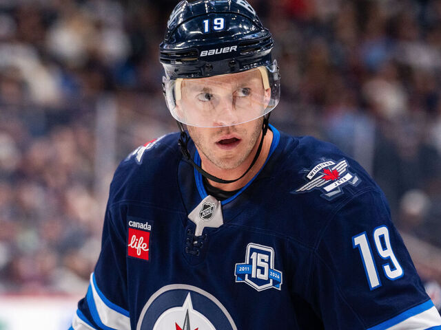 WINNIPEG, CANADA - OCTOBER 9: Jonathan Toews #19 of the Winnipeg Jets prepares for a face-off in the second period against the Dallas Stars at Canada Life Centre on October 9, 2025 in Winnipeg, Canada at Canada Life Centre on October 9, 2025 in Winnipeg, Canada.