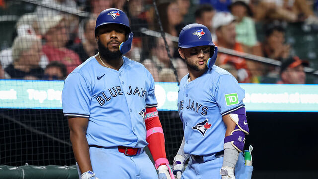 BALTIMORE, MD - JULY 29: Vladimir Guerrero Jr. #27 and Bo Bichette #11 of the Toronto Blue Jays look on during the seventh inning in game two of a split doubleheader against the Baltimore Orioles at Oriole Park at Camden Yards on July 29, 2025 in Baltimore, Maryland.