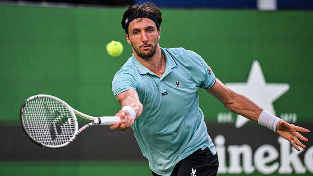 France's Arthur Rinderknech hits a return to Canada's Felix Auger-Aliassime during their quarter-final men's singles match at the Shanghai Masters tennis tournament in Shanghai on October 10, 2025.