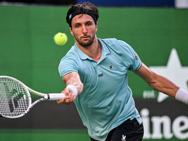 France's Arthur Rinderknech hits a return to Canada's Felix Auger-Aliassime during their quarter-final men's singles match at the Shanghai Masters tennis tournament in Shanghai on October 10, 2025.