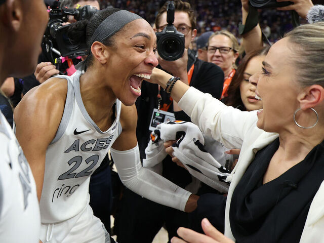 PHOENIX, ARIZONA - OCTOBER 10: A'ja Wilson #22 of the Las Vegas Aces celebrates with head coach Becky Hammon after winning game four of the 2025 WNBA Playoffs finals at Mortgage Matchup Center on October 10, 2025 in Phoenix, Arizona. The Las Vegas Aces defeat the Phoenix Mercury 97-86 to win the championship.