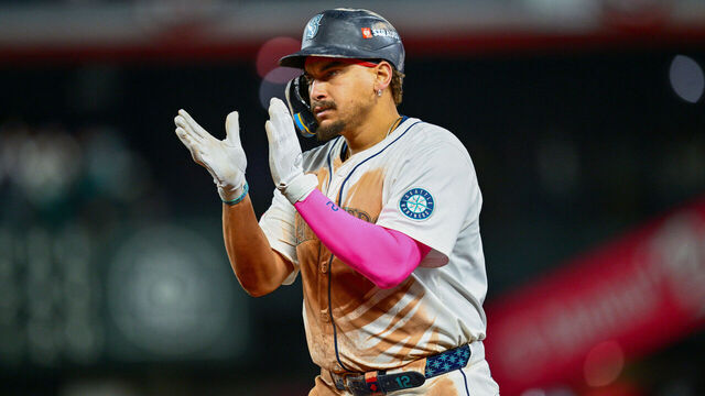 SEATTLE, WA - OCTOBER 10: Josh Naylor #12 of the Seattle Mariners celebrates on first base after singling in the seventh inning during Game Five of the American League Division Series presented by Booking.com between the Detroit Tigers and the Seattle Mariners at T-Mobile Park on Friday, October 10, 2025 in Seattle, Washington.