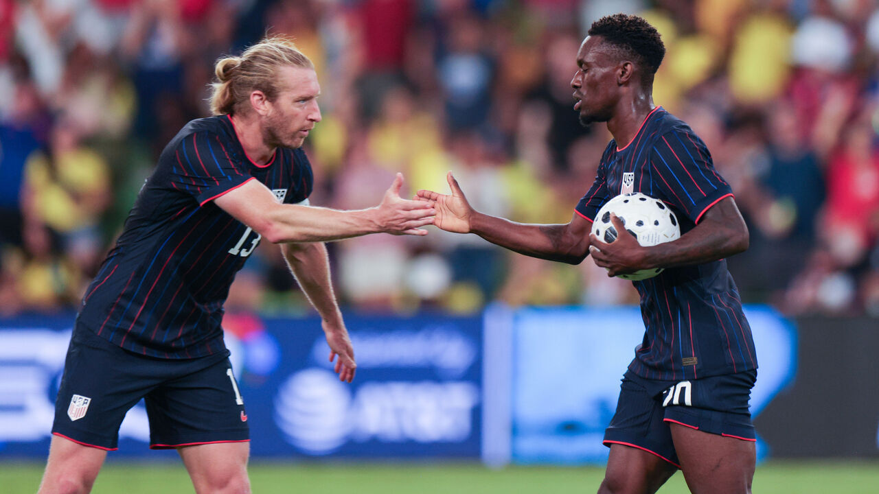 AUSTIN, TEXAS - OCTOBER 10: Folarin Balogun #20 of the United States celebrates scoring with teammate Tim Ream #13 during the second half against Ecuador during an international friendly at Q2 Stadium on October 10, 2025 in Austin, Texas.