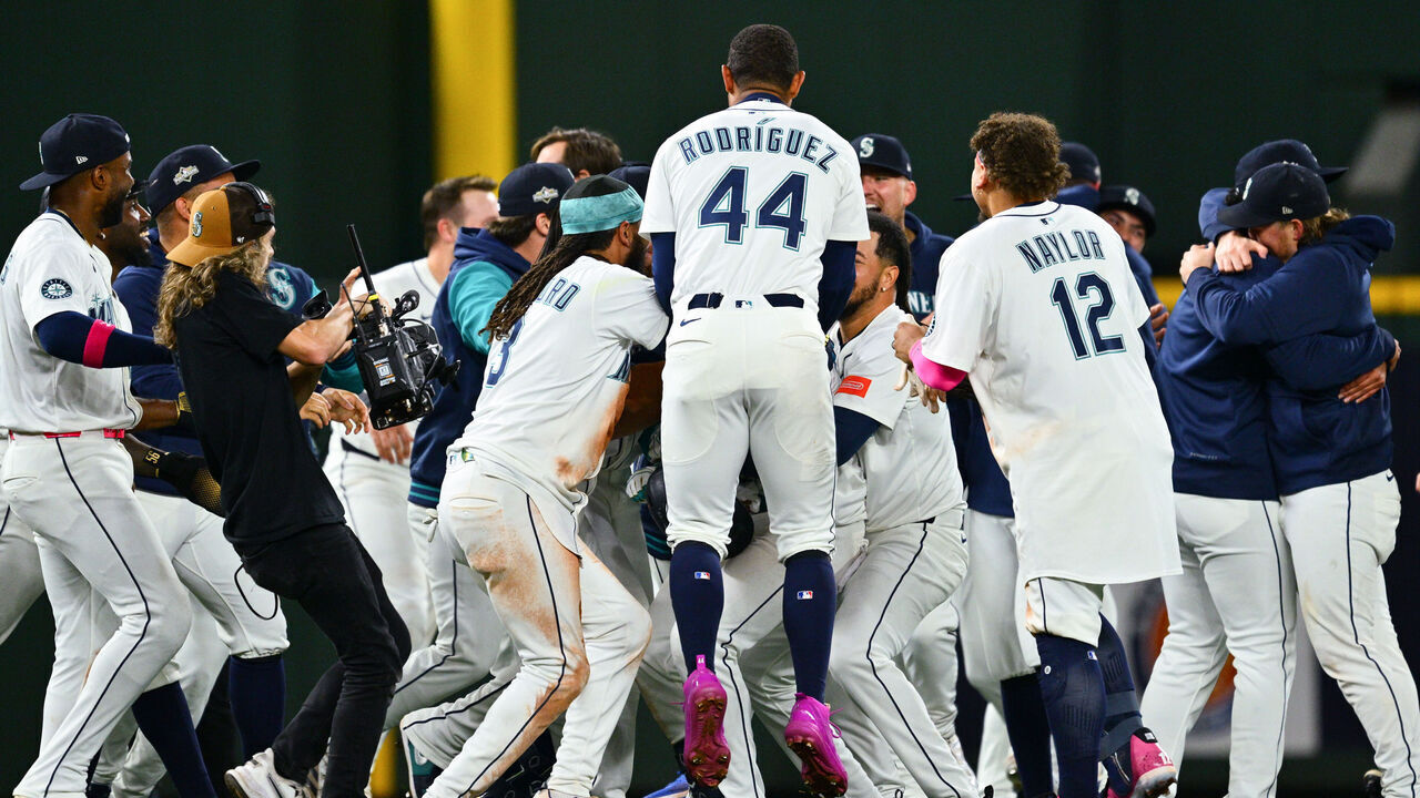 SEATTLE, WA - OCTOBER 10: Members of the Seattle Mariners celebrate on the field after defeating the Detroit Tigers in Game Five of the American League Division Series presented by Booking.com between the Detroit Tigers and the Seattle Mariners at T-Mobile Park on Friday, October 10, 2025 in Seattle, Washington.