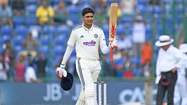 India's captain Shubman Gill celebrates after scoring a century (100 runs) during the second day of the second and last Test cricket match between India and West Indies at the Arun Jaitley Stadium in New Delhi on October 11, 2025.