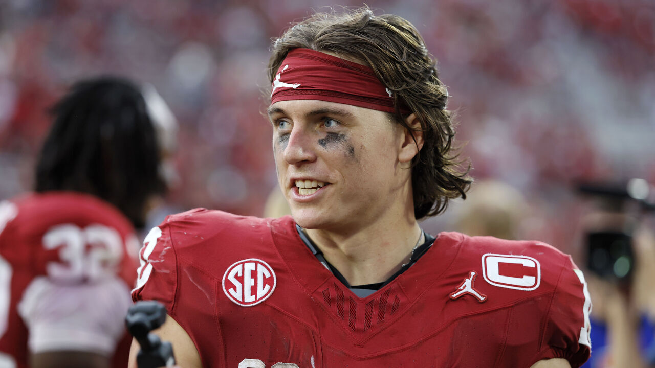 NORMAN, OKLAHOMA - SEPTEMBER 20: Quarterback John Mateer #10 of the Oklahoma Sooners records a greeting for the fans after a 24-17 win over the Auburn Tigers at Gaylord Family Oklahoma Memorial Stadium on September 20, 2025 in Norman, Oklahoma.