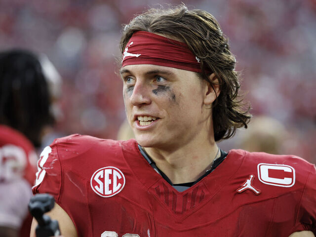 NORMAN, OKLAHOMA - SEPTEMBER 20: Quarterback John Mateer #10 of the Oklahoma Sooners records a greeting for the fans after a 24-17 win over the Auburn Tigers at Gaylord Family Oklahoma Memorial Stadium on September 20, 2025 in Norman, Oklahoma.