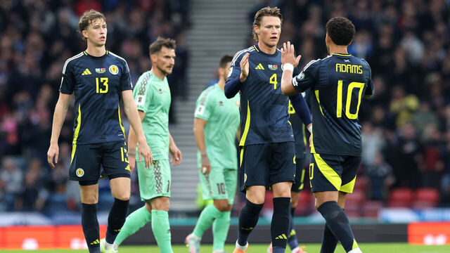 GLASGOW, SCOTLAND - OCTOBER 12: Che Adams of Scotland celebrates with Scott McTominay after scoring his team's first goal during the FIFA World Cup 2026 qualifier match between Scotland and Belarus at Hampden Park on October 12, 2025 in Glasgow, Scotland.