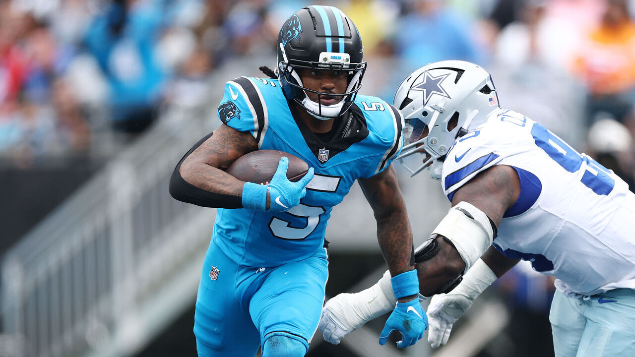 CHARLOTTE, NORTH CAROLINA - OCTOBER 12: Rico Dowdle #5 of the Carolina Panthers carries the ball during the second quarter against the Dallas Cowboys in the game at Bank of America Stadium on October 12, 2025 in Charlotte, North Carolina.
