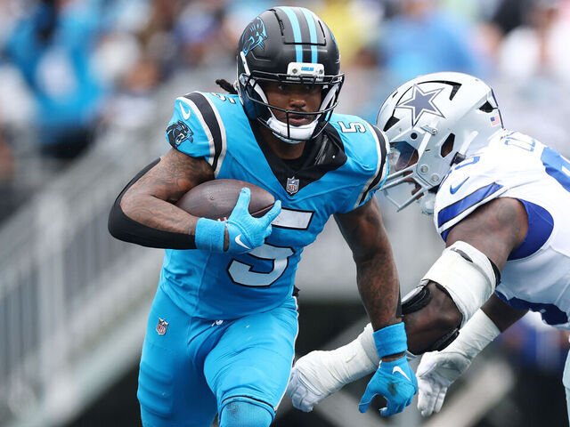 CHARLOTTE, NORTH CAROLINA - OCTOBER 12: Rico Dowdle #5 of the Carolina Panthers carries the ball during the second quarter against the Dallas Cowboys in the game at Bank of America Stadium on October 12, 2025 in Charlotte, North Carolina.