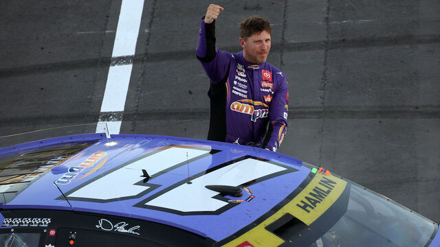 LAS VEGAS, NEVADA - OCTOBER 12: Denny Hamlin, driver of the #11 ampm Toyota, celebrates after winning the NASCAR Cup Series South Point 400 at Las Vegas Motor Speedway on October 12, 2025 in Las Vegas, Nevada.