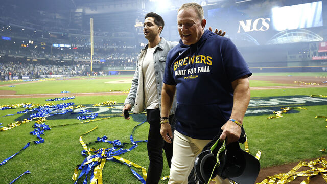 MILWAUKEE, WISCONSIN - OCTOBER 11: (L-R) Ryan Braun hugs Pat Murphy #49 of the Milwaukee Brewers after the Milwaukee Brewers defeated the Chicago Cubs in game five of the National League Division Series at American Family Field on October 11, 2025 in Milwaukee, Wisconsin.