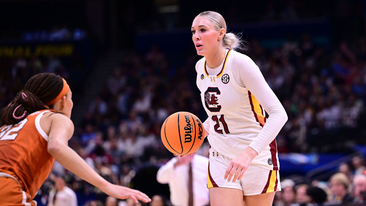 TAMPA, FLORIDA - APRIL 4: Chloe Kitts #21 of the South Carolina Gamecocks dribbles the ball while guarded by Ndjakalenga Mwenentanda #32 of the Texas Longhorns during the NCAA Women's Basketball Tournament Final Four semifinal game at Amalie Arena on April 4, 2025 in Tampa, Florida.