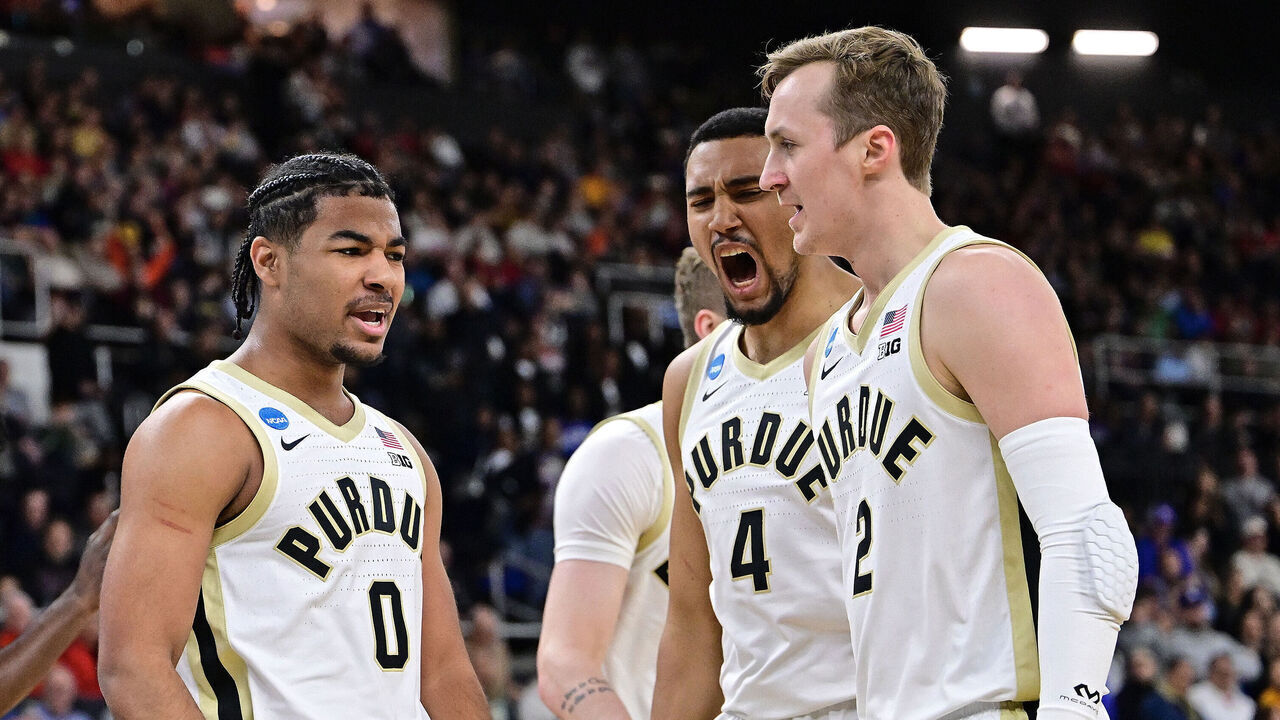 PROVIDENCE, RHODE ISLAND - MARCH 22: C.J. Cox #0, Trey Kaufman-Renn #4, and Fletcher Loyer #2 of the Purdue Boilermakers celebrate a basket agains the McNeese Cowboys during the second round of the 2025 NCAA Men's Basketball Tournament held at Amica Mutual Pavillion on March 22, 2025 in Providence, Rhode Island.