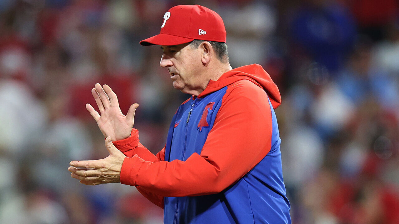 PHILADELPHIA, PENNSYLVANIA - OCTOBER 04: Rob Thomson, Manager of the Philadelphia Phillies, walks to the mound for a pitching change in the seventh inning against the Los Angeles Dodgers in game one of the Division Series at Citizens Bank Park on October 04, 2025 in Philadelphia, Pennsylvania.