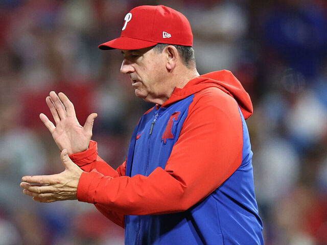 PHILADELPHIA, PENNSYLVANIA - OCTOBER 04: Rob Thomson, Manager of the Philadelphia Phillies, walks to the mound for a pitching change in the seventh inning against the Los Angeles Dodgers in game one of the Division Series at Citizens Bank Park on October 04, 2025 in Philadelphia, Pennsylvania.