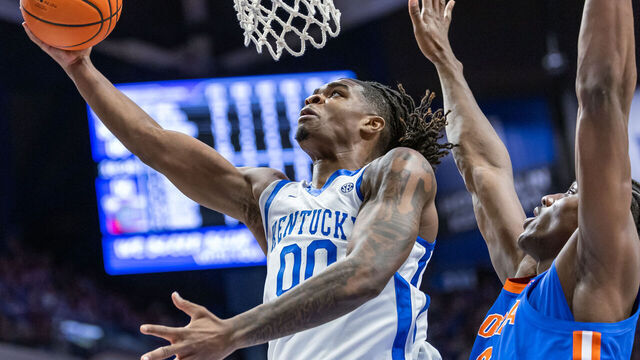LEXINGTON, KENTUCKY - JANUARY 4: Otega Oweh #0 of the Kentucky Wildcats shoots the ball against Rueben Chinyelu #9 of the Florida Gators at Rupp Arena on January 4, 2025 in Lexington, Kentucky.