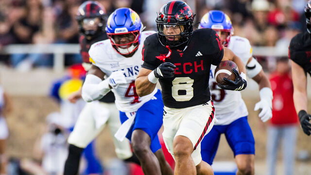 LUBBOCK, TEXAS - OCTOBER 11: Cameron Dickey #8 of the Texas Tech Red Raiders runs for a touchdown during the first half of the game against the Kansas Jayhawks at Jones AT&T Stadium on October 11, 2025 in Lubbock, Texas.