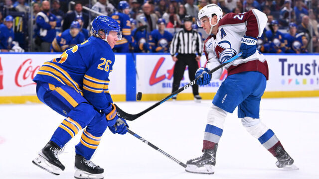 BUFFALO, NEW YORK - OCTOBER 13: Rasmus Dahlin #26 of the Buffalo Sabres blocks a shot from Nathan MacKinnon #29 of the Colorado Avalanche during the third period of an NHL game at KeyBank Center on October 13, 2025 in Buffalo, New York. Colorado won, 3-1.