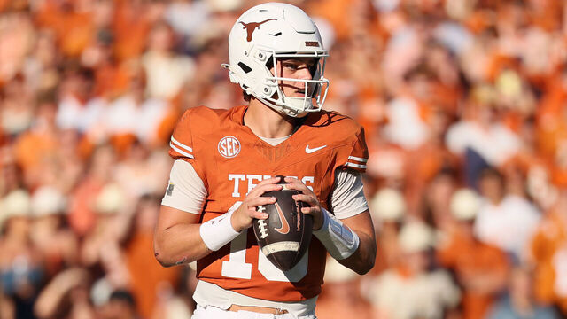 DALLAS, TEXAS - OCTOBER 11: Arch Manning #16 of the Texas Longhorns looks to pass during the second half against the Oklahoma Sooners at Cotton Bowl Stadium on October 11, 2025 in Dallas, Texas.