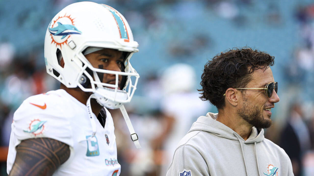 MIAMI GARDENS, FLORIDA - NOVEMBER 24: Tua Tagovailoa #1 of the Miami Dolphins talks with head coach Mike McDaniel prior to an NFL football game against the New England Patriots at Hard Rock Stadium on November 24, 2024 in Miami Gardens, Florida.