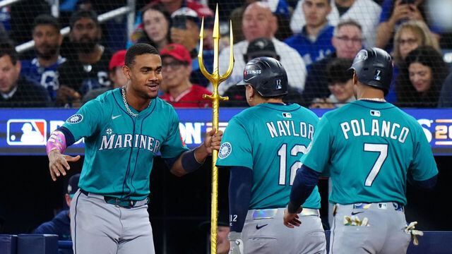 TORONTO, ON - OCTOBER 13: Josh Naylor #12 of the Seattle Mariners celebrates with Julio Rodríguez #44 after hitting a two-run home run in the seventh inning during Game Two of the American League Championship Series presented by loanDepot between the Seattle Mariners and the Toronto Blue Jays at Rogers Centre on Monday, October 13, 2025 in Toronto, Ontario, Canada.
