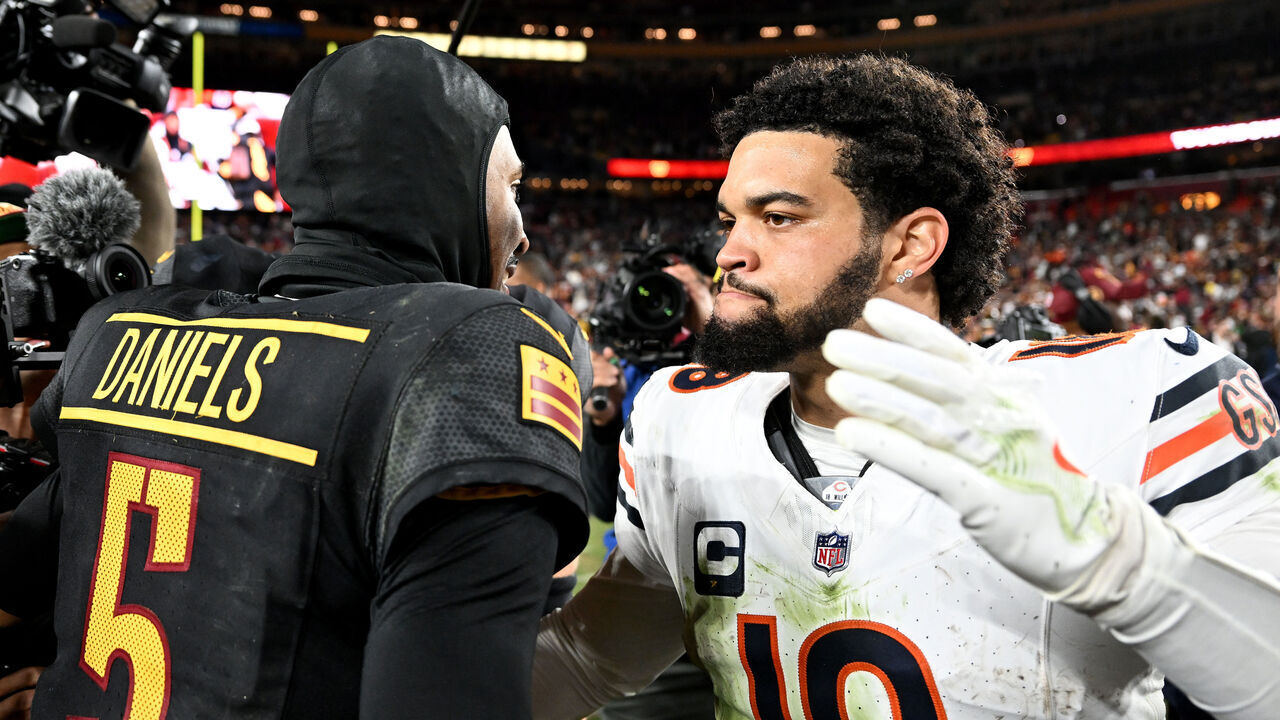 LANDOVER, MARYLAND - OCTOBER 27: Jayden Daniels #5 of the Washington Commanders and Caleb Williams #18 of the Chicago Bears embrace after the game at Northwest Stadium on October 27, 2024 in Landover, Maryland.