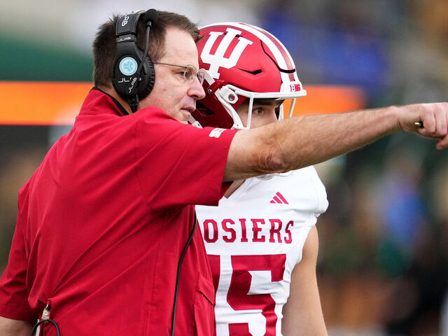 EUGENE, OREGON - OCTOBER 11: Head coach Curt Cignetti of the Indiana Hoosiers talks with Fernando Mendoza #15 of the Indiana Hoosiers during the second half against the Oregon Ducks at Autzen Stadium on October 11, 2025 in Eugene, Oregon.