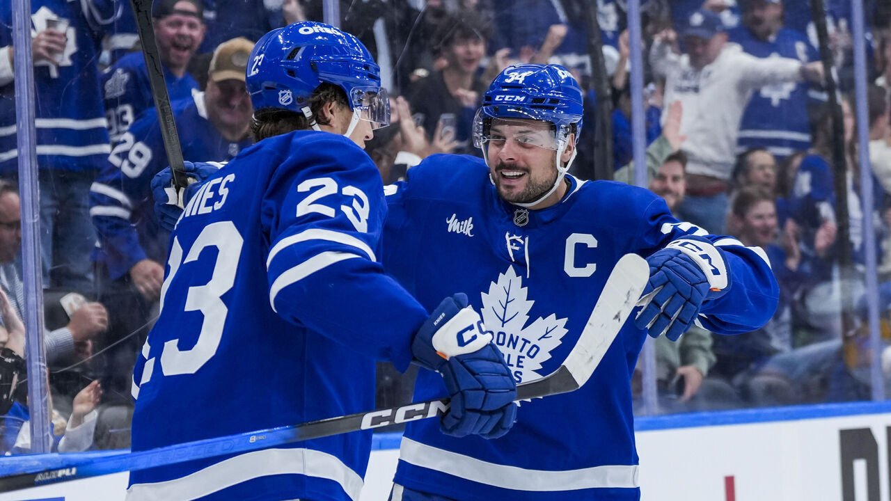 TORONTO, CANADA - OCTOBER 14: Auston Matthews #34 celebrates scoring a goal with Matthew Knies #23 of the Toronto Maple Leafs against the Nashville Predators during the third period at the Scotiabank Arena on October 14, 2025 in Toronto, ON, Canada.