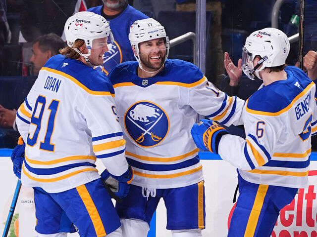 BUFFALO, NEW YORK - OCTOBER 15: Jason Zucker #17 of the Buffalo Sabres celebrates his goal with Josh Doan #91 and Zach Benson #6 against the Ottawa Senators during second period on October 15, 2025 at KeyBank Center in Buffalo, New York.