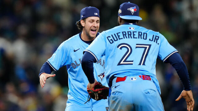 SEATTLE, WA - OCTOBER 15: Ernie Clement #22 and Vladimir Guerrero Jr. #27 of the Toronto Blue Jays celebrate after winning Game Three of the American League Championship Series presented by loanDepot between the Toronto Blue Jays and the Seattle Mariners at T-Mobile Park on Wednesday, October 15, 2025 in Seattle, Washington.
