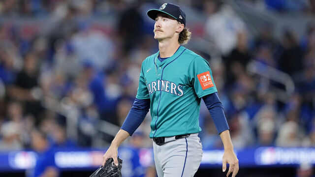 TORONTO, ONTARIO - OCTOBER 12: Bryce Miller #50 of the Seattle Mariners walks to the dugout after pitching the first inning against the Toronto Blue Jays in game one of the American League Championship Series at Rogers Centre on October 12, 2025 in Toronto, Ontario.