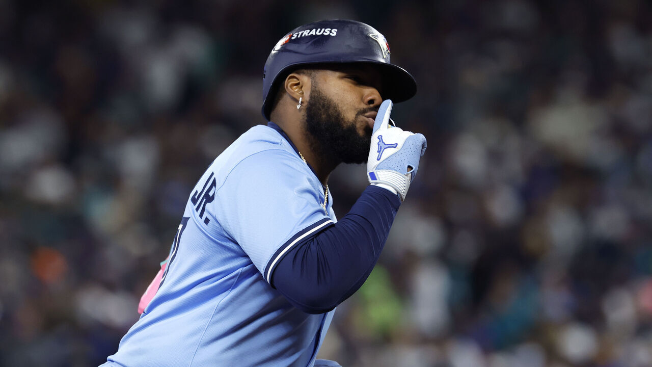 SEATTLE, WASHINGTON - OCTOBER 16: Vladimir Guerrero Jr. #27 of the Toronto Blue Jays rounds the bases after hitting a solo home run against the Seattle Mariners during the seventh inning in game four of the American League Championship Series at T-Mobile Park on October 16, 2025 in Seattle, Washington.