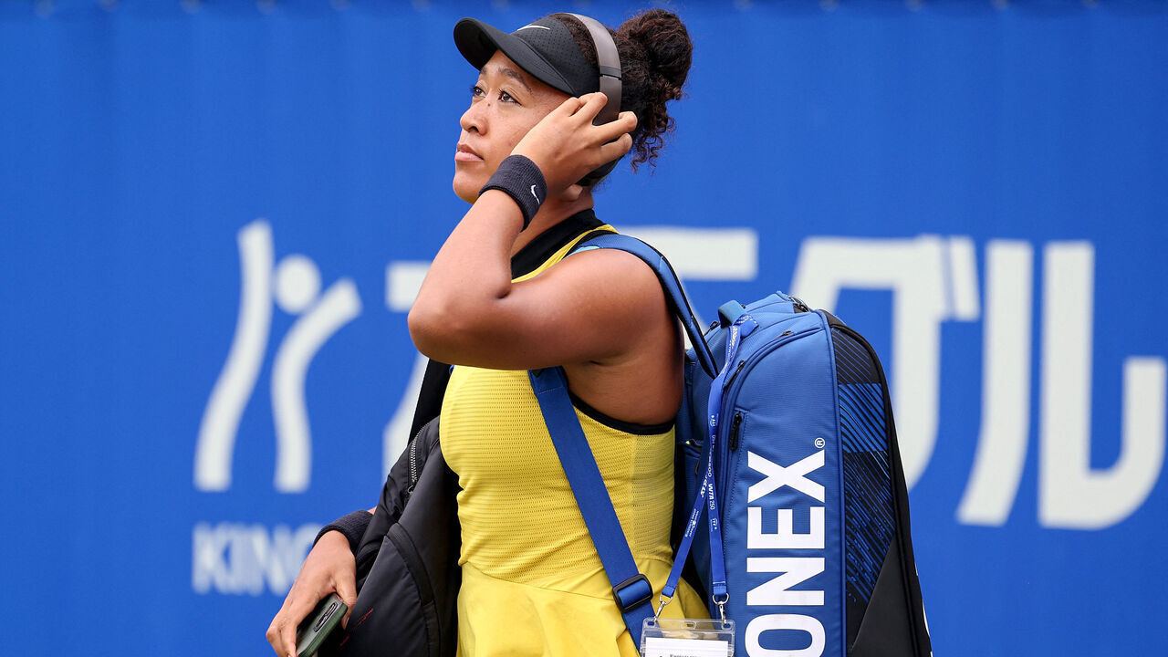 Japan's Naomi Osaka arrives to play against Netherlands' Suzan Lamens during their women's singles match at the Japan Open tennis tournament in Osaka on October 15, 2025.