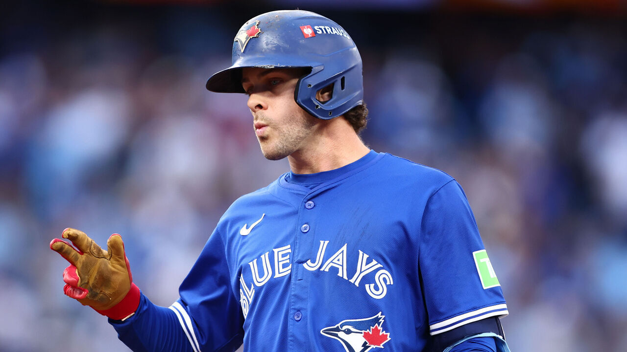 TORONTO, ONTARIO - OCTOBER 13: Ernie Clement #22 of the Toronto Blue Jays reacts after hitting a single against the Seattle Mariners during the second inning in game two of the American League Championship Series at Rogers Centre on October 13, 2025 in Toronto, Ontario.